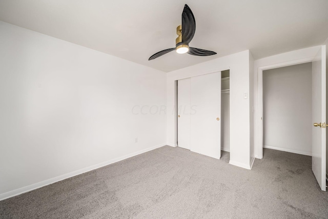 unfurnished bedroom featuring carpet floors, a closet, and ceiling fan