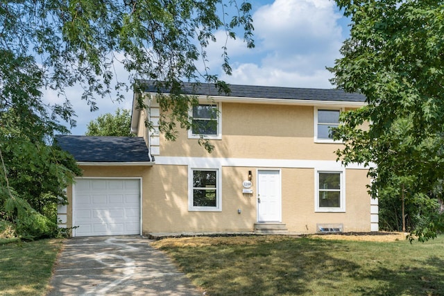 view of front of home featuring a garage and a front yard