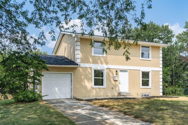 view of front of house with a front yard and a garage