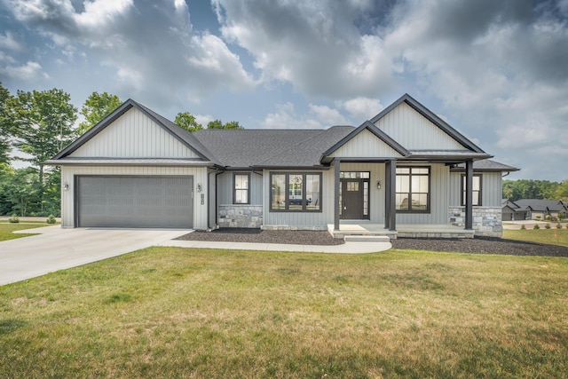 view of front of property featuring a front lawn, a porch, and a garage