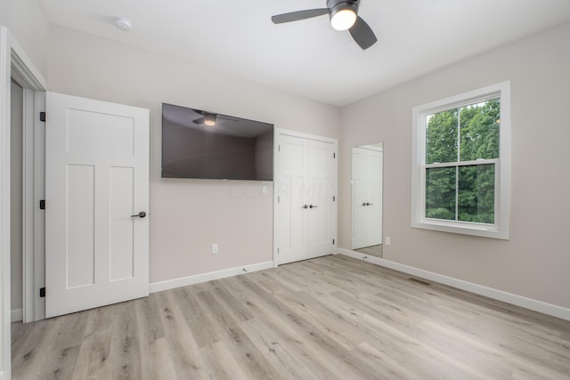 unfurnished bedroom featuring ceiling fan and light hardwood / wood-style floors