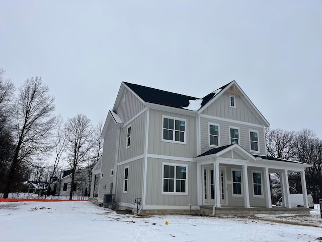 view of front of home with cooling unit and covered porch