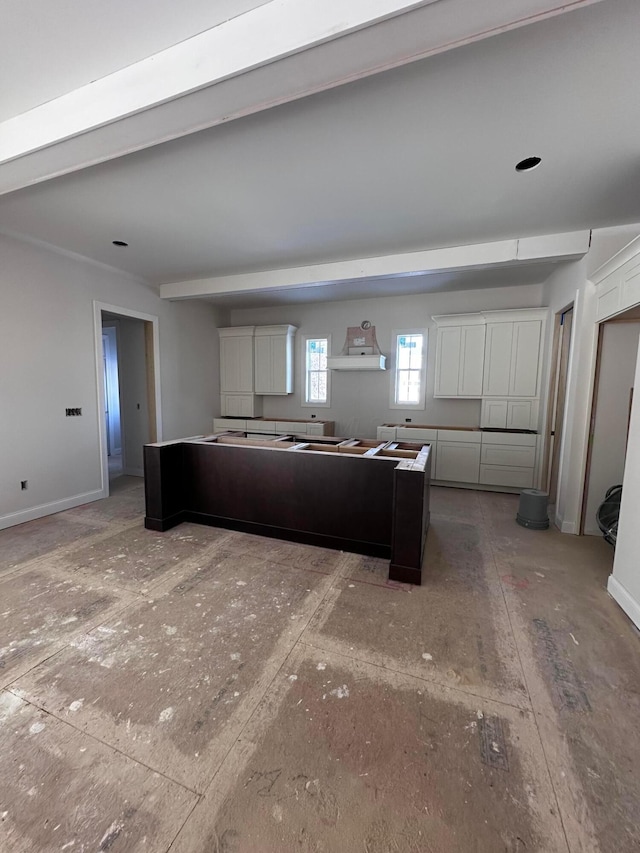 kitchen with white cabinetry and a center island