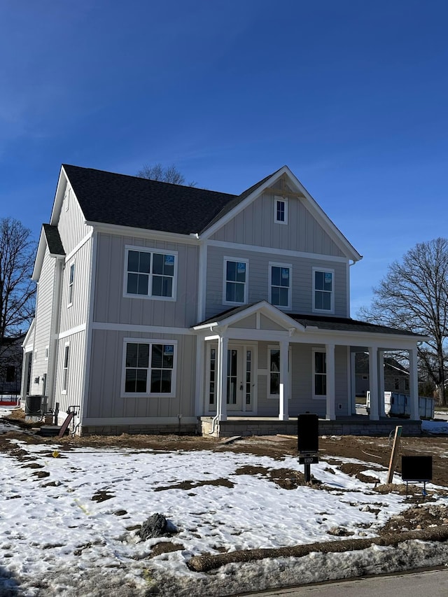 view of front of home with cooling unit and covered porch