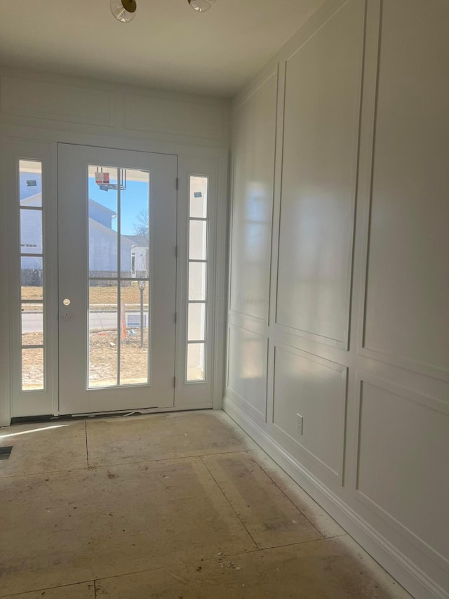 entryway with visible vents and a decorative wall