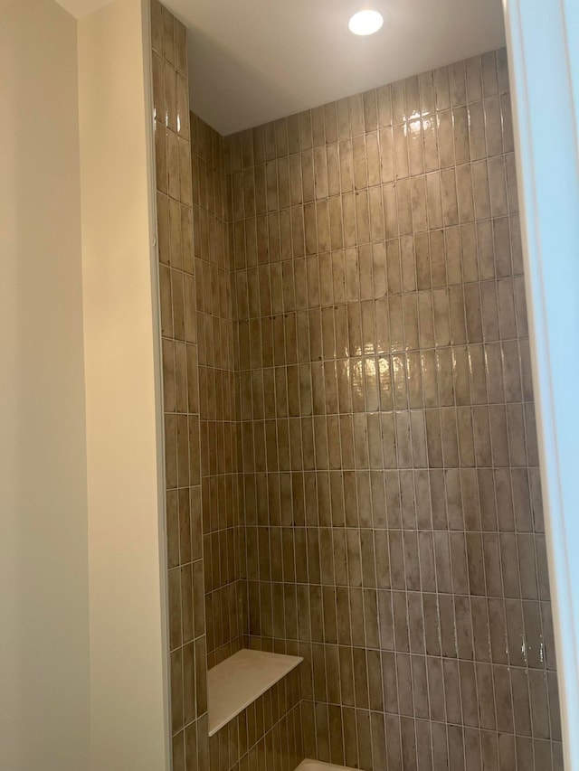 full bathroom with a tile shower