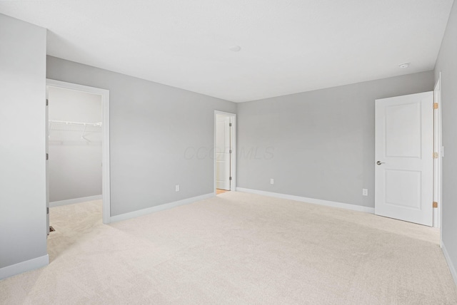 empty room featuring light colored carpet