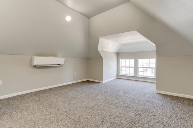 additional living space with carpet floors, a wall mounted AC, and lofted ceiling