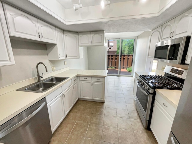 kitchen with sink, light tile patterned flooring, a chandelier, white cabinets, and appliances with stainless steel finishes