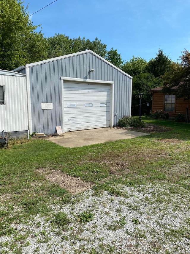 garage featuring a yard