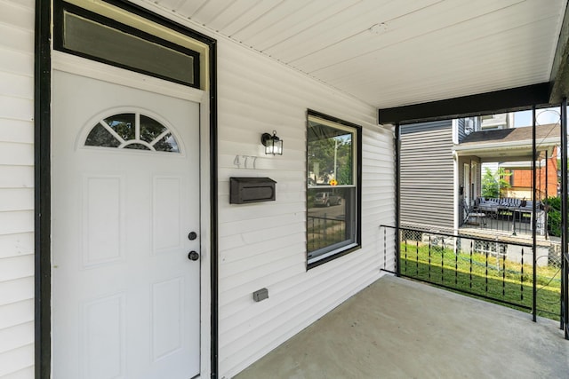 doorway to property featuring covered porch