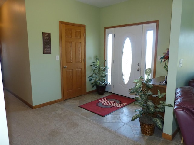 entryway featuring light carpet