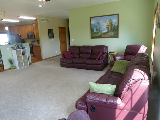 living room featuring light colored carpet