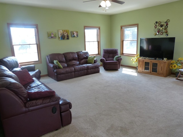 living room with light carpet and ceiling fan