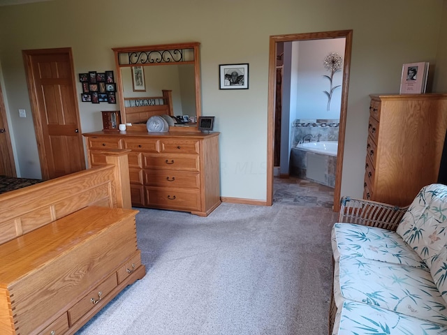 carpeted bedroom with connected bathroom