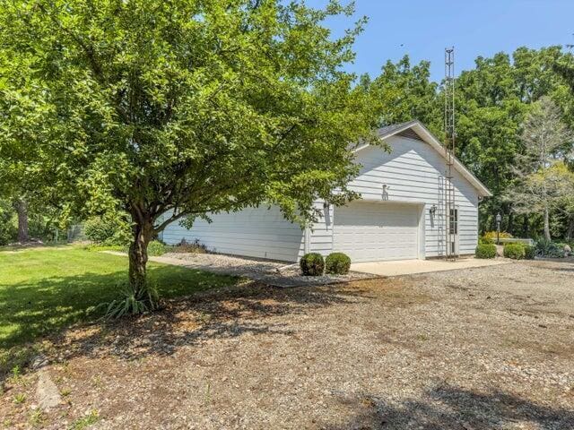 view of property exterior featuring a garage