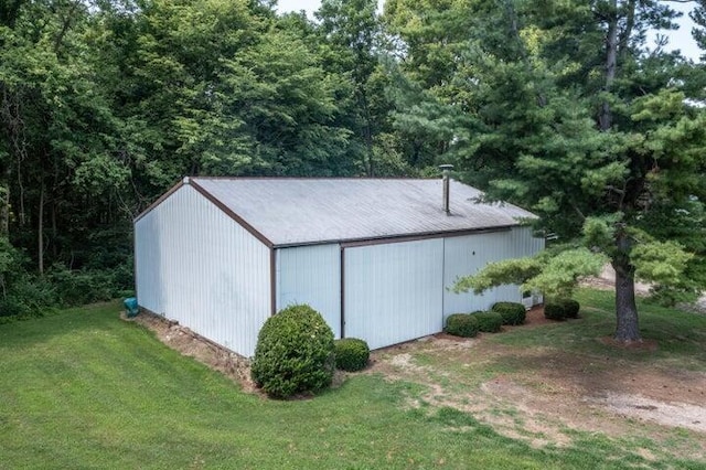 view of outdoor structure with a yard