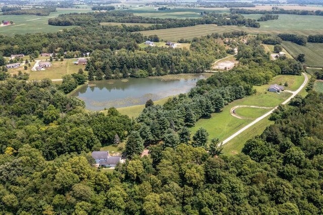 birds eye view of property with a rural view and a water view