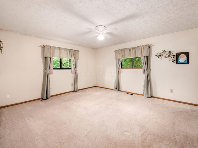 6611 Morse Rd, New Albany, OH 43054 - spare room with a ceiling fan, light carpet, and a textured ceiling