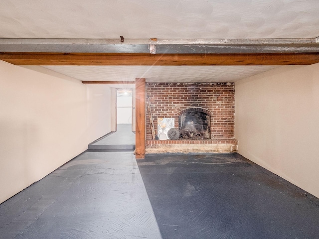 unfurnished living room with a brick fireplace