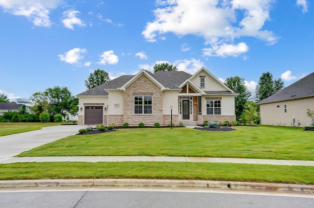 craftsman house featuring a front yard and a garage