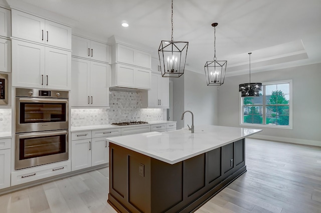 kitchen featuring white cabinets and appliances with stainless steel finishes