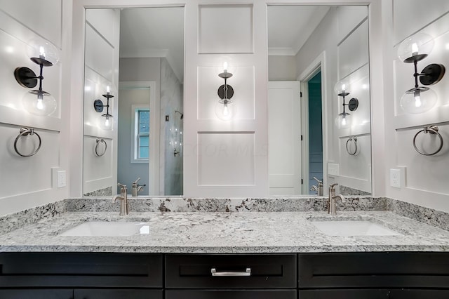 bathroom with vanity and crown molding