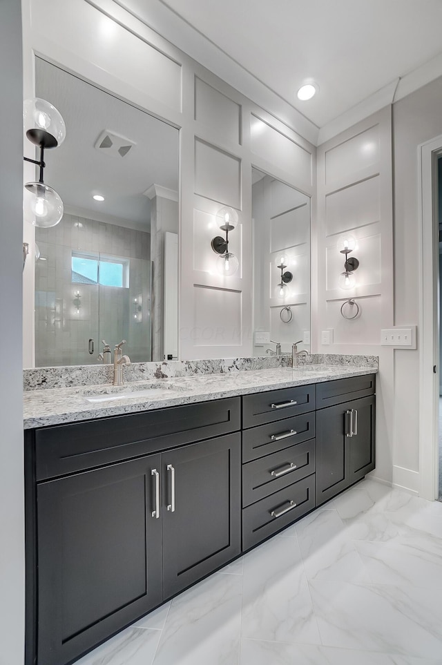 bathroom featuring vanity and an enclosed shower