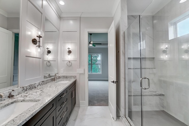 bathroom featuring vanity, ceiling fan, crown molding, and walk in shower