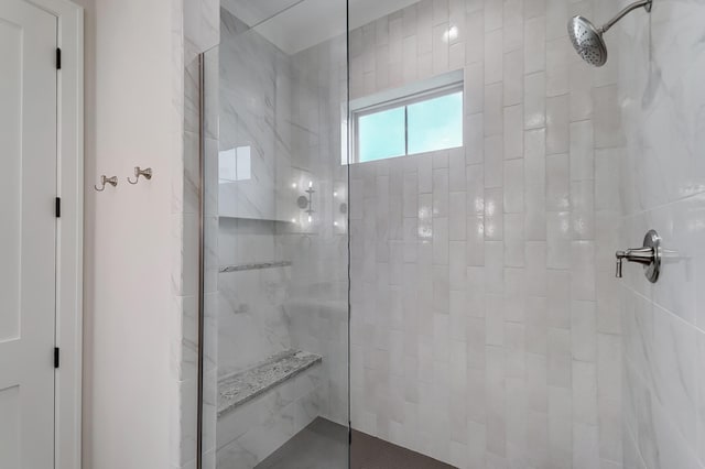 bathroom with tiled shower