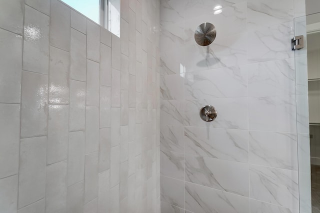 bathroom with tiled shower