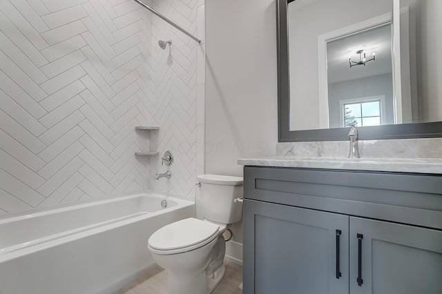 full bathroom with tiled shower / bath combo, toilet, and vanity