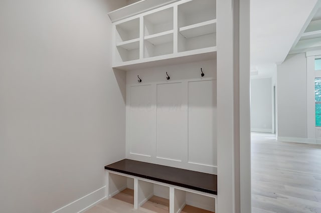 mudroom with light hardwood / wood-style floors