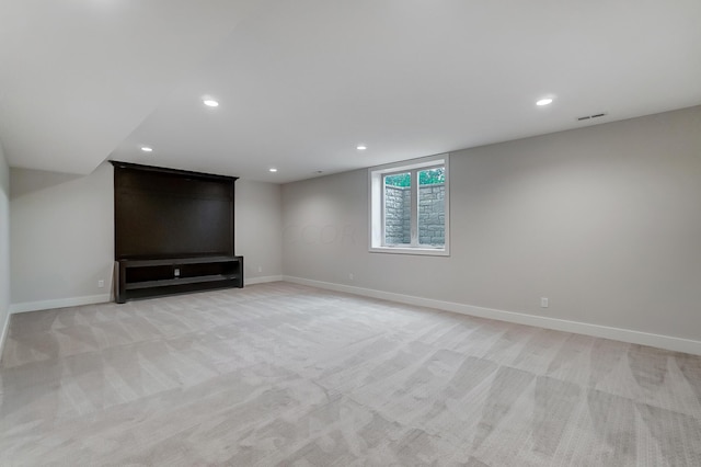 unfurnished living room with light colored carpet