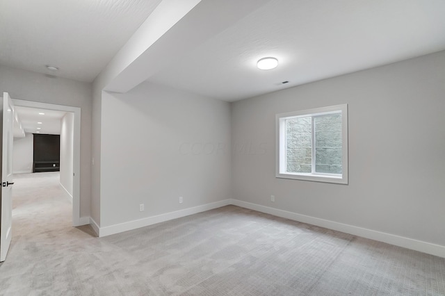 empty room featuring light colored carpet