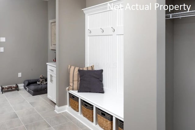 mudroom with light tile patterned floors