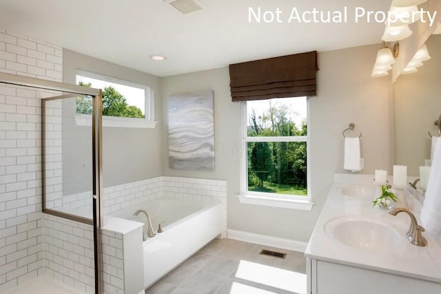 bathroom featuring vanity, tile patterned floors, and a wealth of natural light