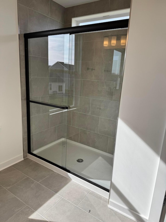 bathroom featuring tile patterned floors and walk in shower