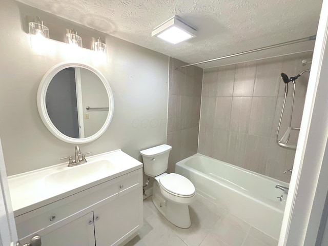 full bathroom featuring vanity, tile patterned floors, tiled shower / bath combo, toilet, and a textured ceiling