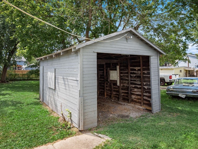 view of outdoor structure featuring a lawn