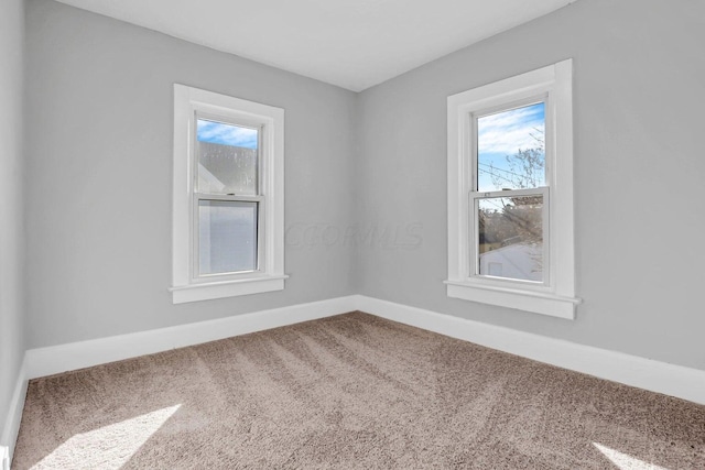 empty room featuring carpet flooring