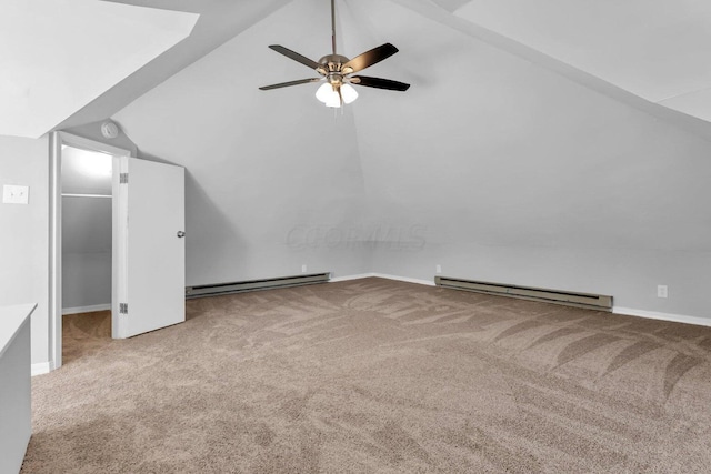 bonus room with light colored carpet, vaulted ceiling, and baseboard heating