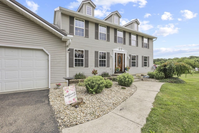 colonial inspired home with a garage