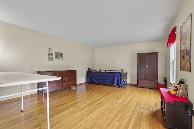 bedroom featuring light wood-type flooring