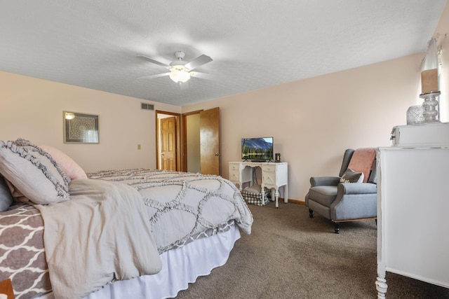 bedroom with carpet flooring, ceiling fan, and a textured ceiling