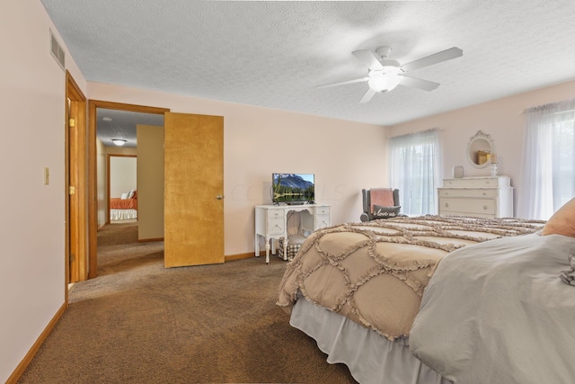 bedroom with carpet flooring, a textured ceiling, and ceiling fan