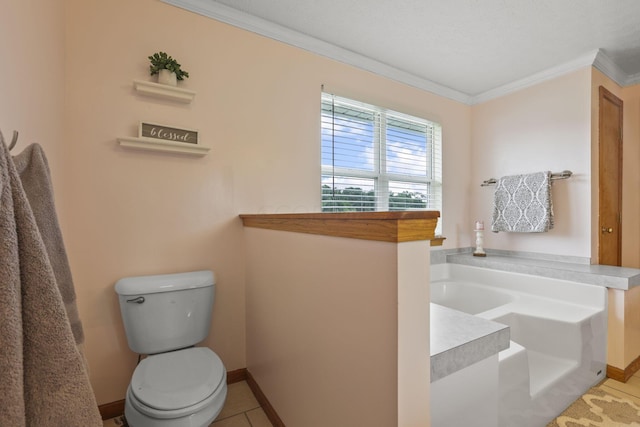 bathroom with tile patterned flooring, toilet, a bathing tub, and crown molding