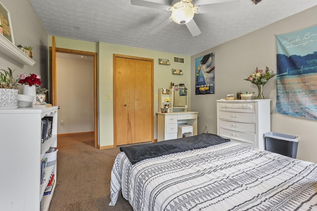 carpeted bedroom with ceiling fan and a textured ceiling