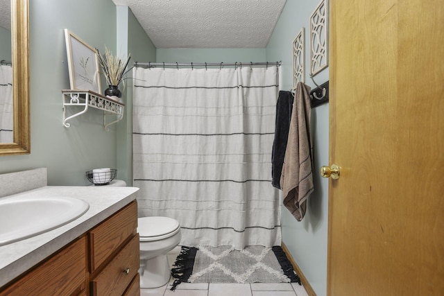 bathroom featuring vanity, tile patterned floors, toilet, a textured ceiling, and curtained shower