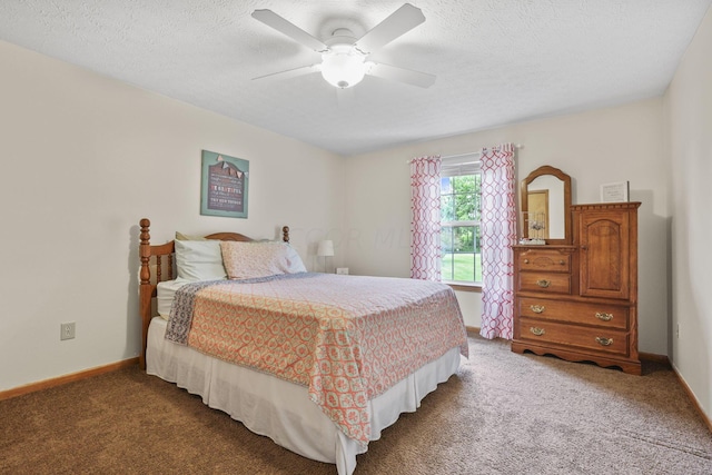 carpeted bedroom with a textured ceiling and ceiling fan